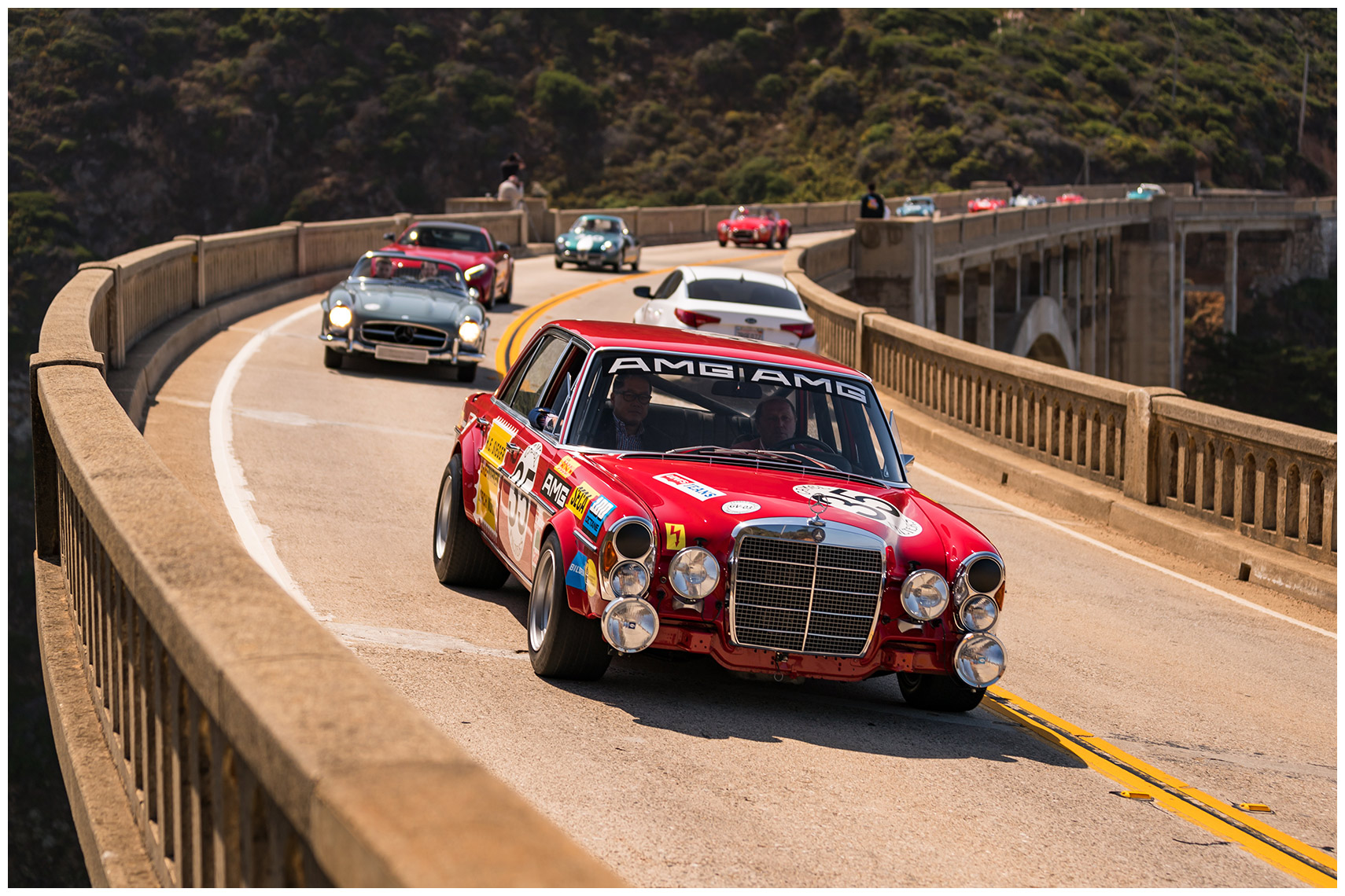jochen mass drives the amg 300 sel 6.8 red pig across the bixby bridge in the 2017 tour d